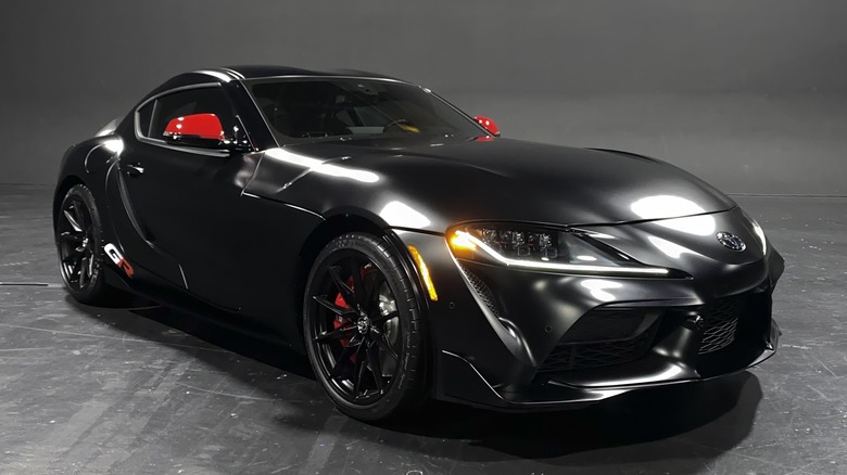 front three quarters shot of a matte black Supra Final Edition with the GT4 Style Pack in a studio