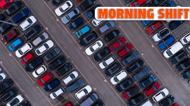 erial view of rows of parked cars lined up for sale for export and import tariffs to America